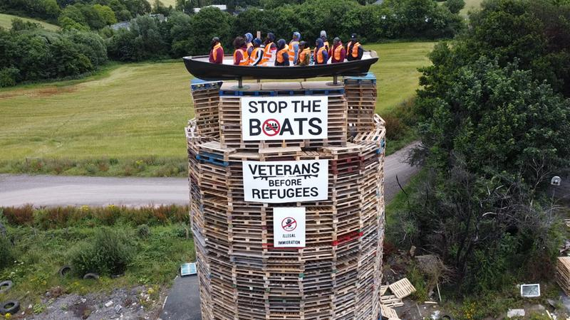 A bonfire in Moygashel, beside Dungannon in Co. Tyrone, with an effigy of a migrant boat on top of it